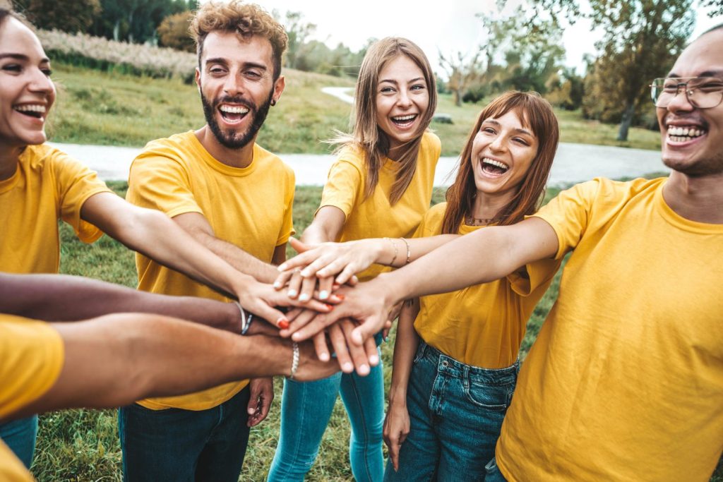 group of college students working together, representing fraternities and sororities